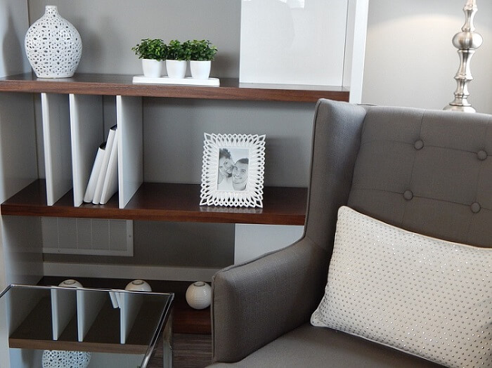 a living room detail with grey furniture