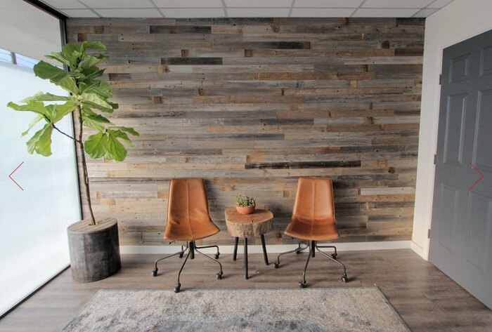 room with two chairs, small table, plant and Epic Artifactory DIY Reclaimed Barn Wood Wall